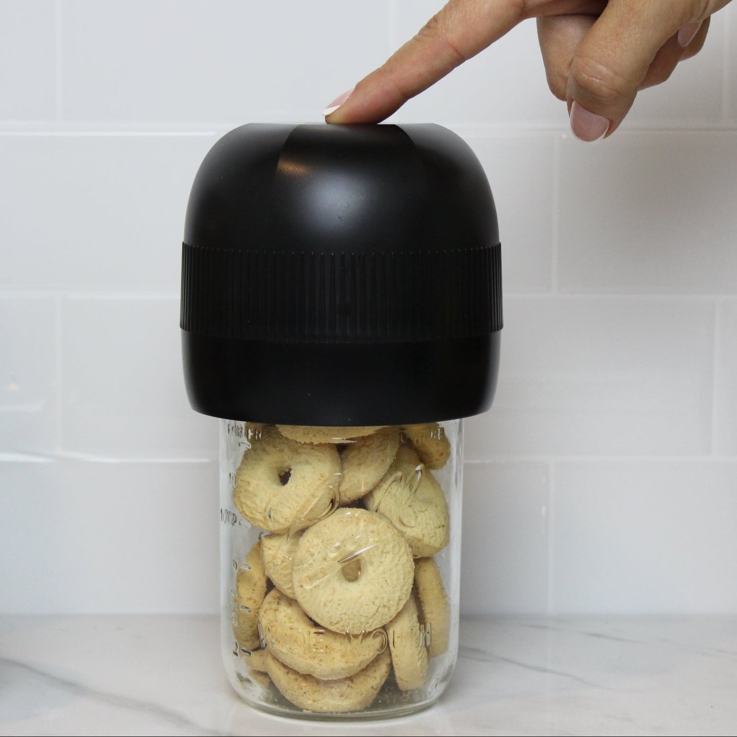 Using VidaVac to vacuum seal regular mouth mason jar with cookies