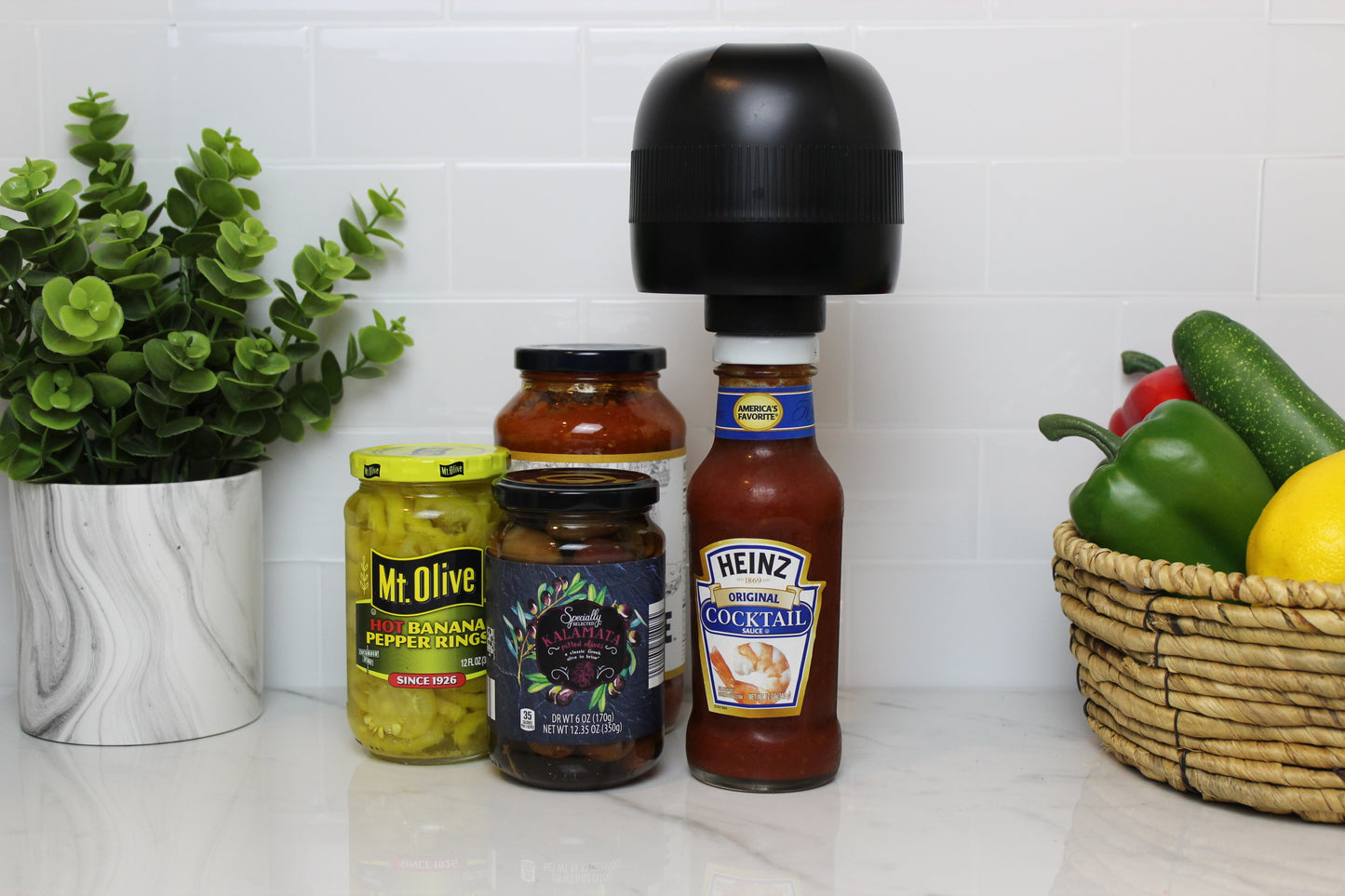 Vacuum sealing a twist lid jar using VidaVac hole punch and silicone umbrella system