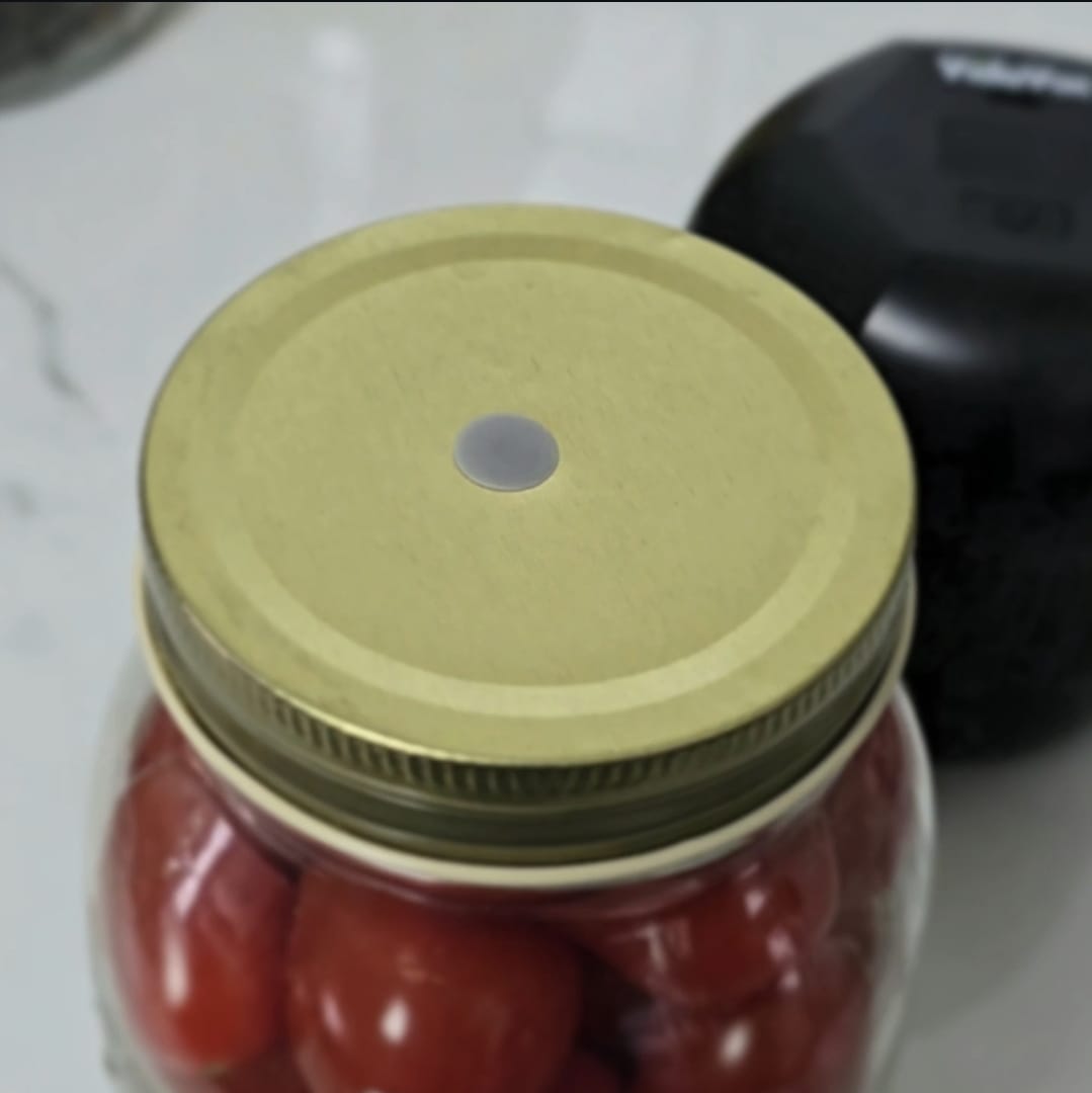 Silicone umbrella insert placed in twist lid jar for vacuum sealing